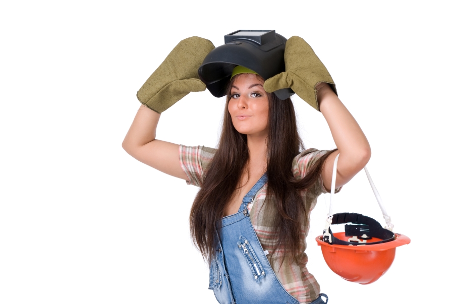 Young woman in welding mask.