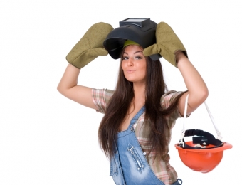 Young woman in welding mask.